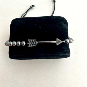 Thread and beads bracelet with a Arrow